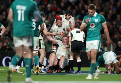 060326 - Ireland v Wales - Guinness Six Nations Championship - Rhys Carre of Wales celebrates scoring a try with team mates