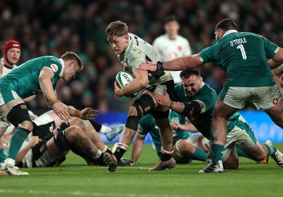 060326 - Ireland v Wales - Guinness Six Nations Championship - Alex Mann of Wales is tackled by Ronan Kelleher of Ireland 