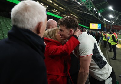 060326 - Ireland v Wales - Guinness Six Nations Championship - Louie Hennessey of Wales with family at full time