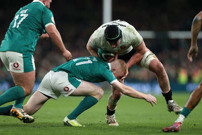 060326 - Ireland v Wales - Guinness Six Nations Championship - Adam Beard of Wales is tackled by Nathan Doak of Ireland 