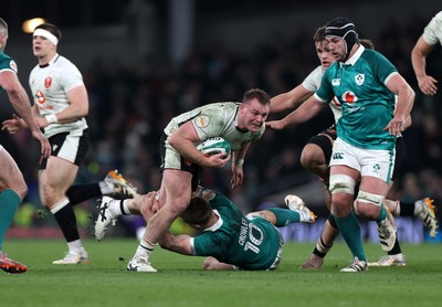 060326 - Ireland v Wales - Guinness Six Nations Championship - Dewi Lake of Wales is tackled by Jack Crowley of Ireland 