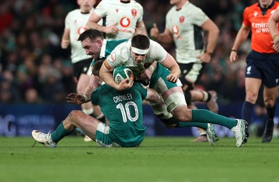 060326 - Ireland v Wales - Guinness Six Nations Championship - Joe Hawkins of Wales is tackled by Jack Crowley of Ireland 