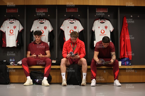 060326 - Ireland v Wales - Guinness Six Nations Championship - Eddie James, Ellis Mee and Louis Rees-Zammit of Wales in the changing rooms