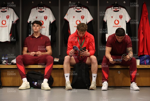060326 - Ireland v Wales - Guinness Six Nations Championship - Eddie James, Ellis Mee and Louis Rees-Zammit of Wales in the changing rooms