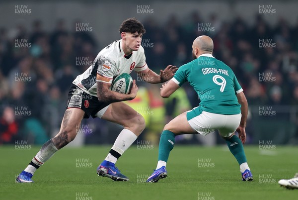 060326 - Ireland v Wales - Guinness Six Nations Championship - Eddie James of Wales is tackled by Jamison Gibson-Park of Ireland 