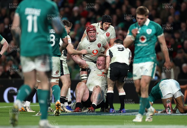 060326 - Ireland v Wales - Guinness Six Nations Championship - Rhys Carre of Wales celebrates scoring a try with team mates