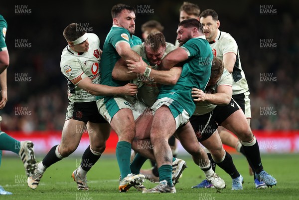 060326 - Ireland v Wales - Guinness Six Nations Championship - Dewi Lake of Wales is tackled by Ronan Kelleher and Tom O�Toole of Ireland 