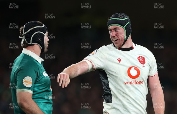060326 - Ireland v Wales - Guinness Six Nations Championship - Caelan Doris of Ireland and Adam Beard of Wales 
