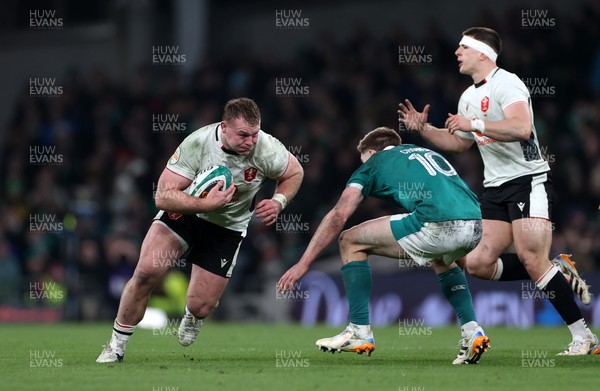 060326 - Ireland v Wales - Guinness Six Nations Championship - Dewi Lake of Wales is tackled by Jack Crowley of Ireland 