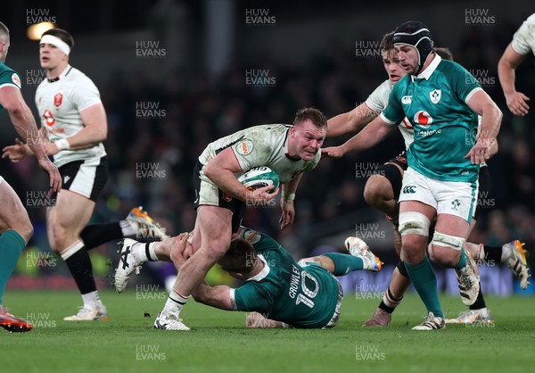 060326 - Ireland v Wales - Guinness Six Nations Championship - Dewi Lake of Wales is tackled by Jack Crowley of Ireland 
