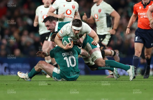 060326 - Ireland v Wales - Guinness Six Nations Championship - Joe Hawkins of Wales is tackled by Jack Crowley of Ireland 