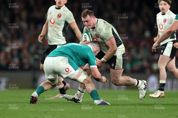 060326 - Ireland v Wales - Guinness Six Nations Championship - Dewi Lake of Wales is tackled by Nick Timoney of Ireland 