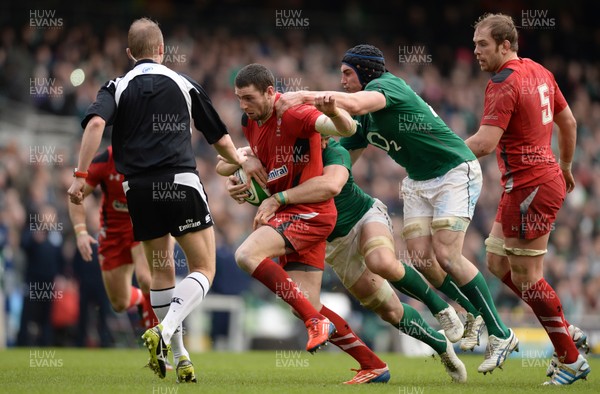 080214 - Ireland v Wales - RBS Six Nations 2014 -Alex Cuthbert of Wales is tackled by Jamie Heaslip of Ireland