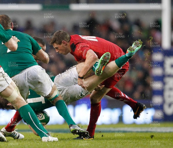 080214 - Ireland v Wales - RBS 6 Nations -  Gordon D'Arcy of Ireland is upended by Rhys Priestland of Wales(c) Huw Evans Agency