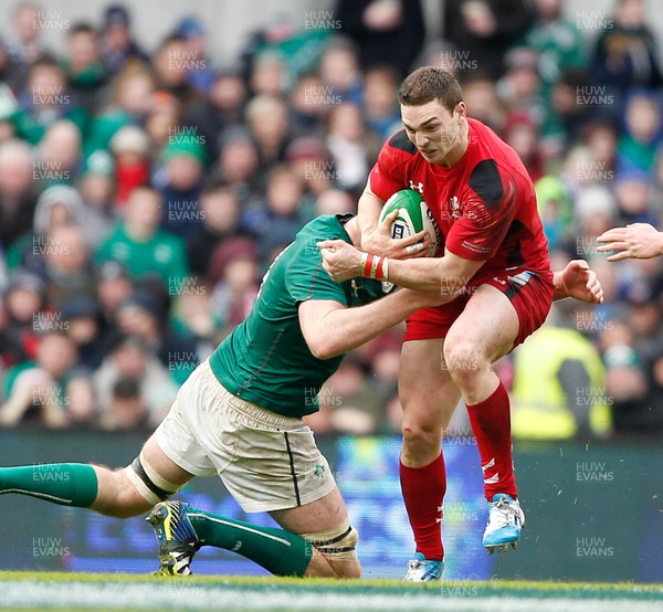 080214 - Ireland v Wales - RBS 6 Nations -  George North of Wales tackled by Devin Toner of Ireland(c) Huw Evans Agency