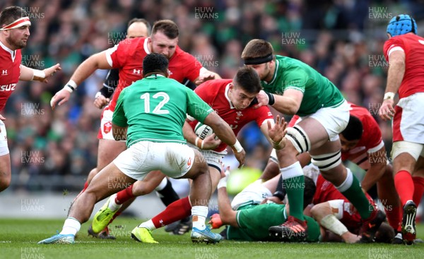 080220 - Ireland v Wales - Guinness Six Nations - Josh Adams of Wales looks for a way past Bundee Aki of Ireland