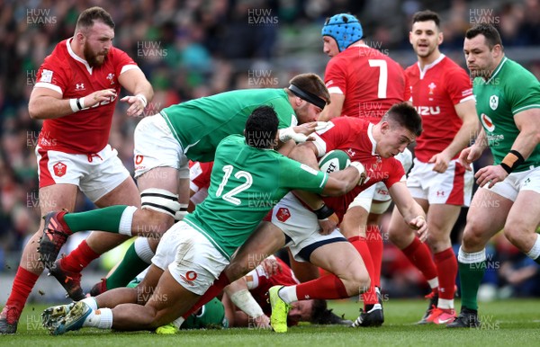 080220 - Ireland v Wales - Guinness Six Nations - Josh Adams of Wales is tackled by Bundee Aki of Ireland
