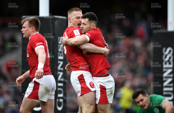 080220 - Ireland v Wales - Guinness Six Nations - Tomos Williams of Wales celebrates scoring try with Johnny McNicholl (left)