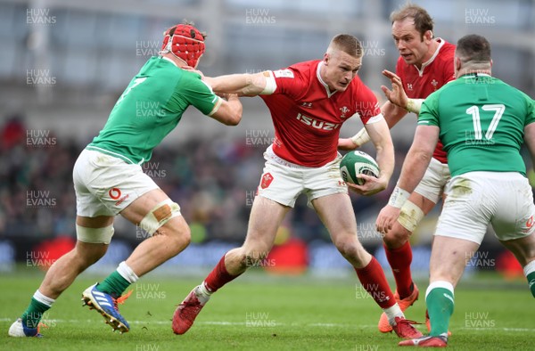 080220 - Ireland v Wales - Guinness Six Nations - Johnny McNicholl of Wales tries to get past Josh van der Flier of Ireland