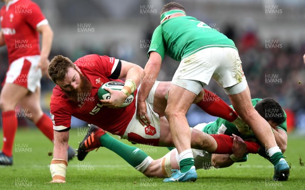 080220 - Ireland v Wales - Guinness Six Nations - Jake Ball of Wales is tackled by James Ryan and Rob Herring of Ireland