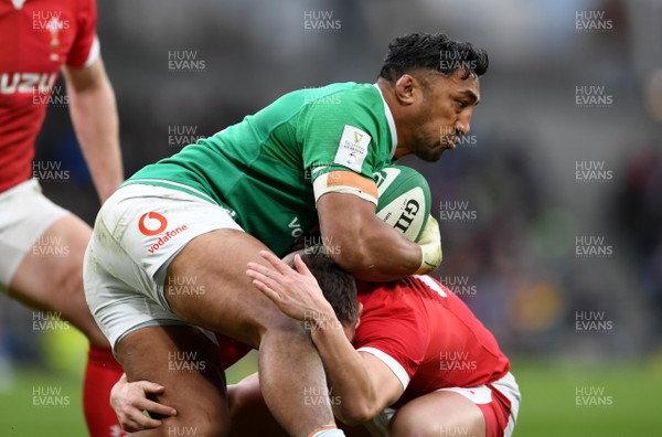 080220 - Ireland v Wales - Guinness Six Nations - Bundee Aki of Ireland is tackled by Jarrod Evans of Wales