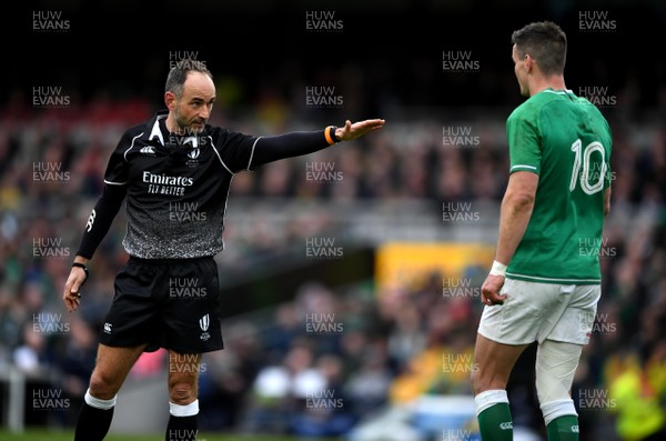 080220 - Ireland v Wales - Guinness Six Nations - Referee Romain Poite and Jonathan Sexton of Ireland