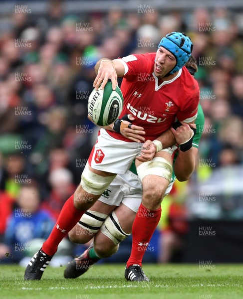 080220 - Ireland v Wales - Guinness Six Nations - Justin Tipuric of Wales is tackled by Iain Henderson of Ireland