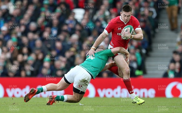080220 - Ireland v Wales - Guinness 6 Nations - Josh Adams of Wales is tackled by Andrew Conway of Ireland