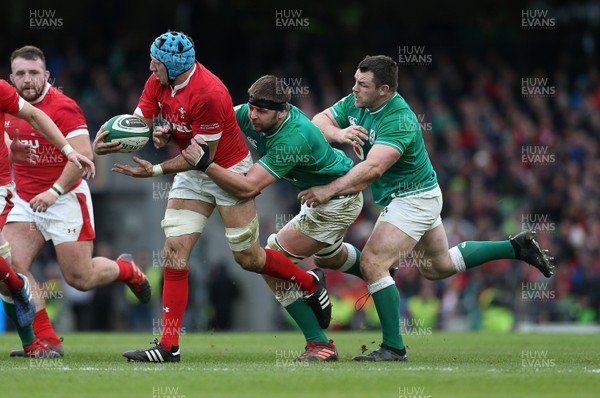 080220 - Ireland v Wales - Guinness 6 Nations - Justin Tipuric of Wales is tackled by Iain Henderson and Cian Healy of Ireland