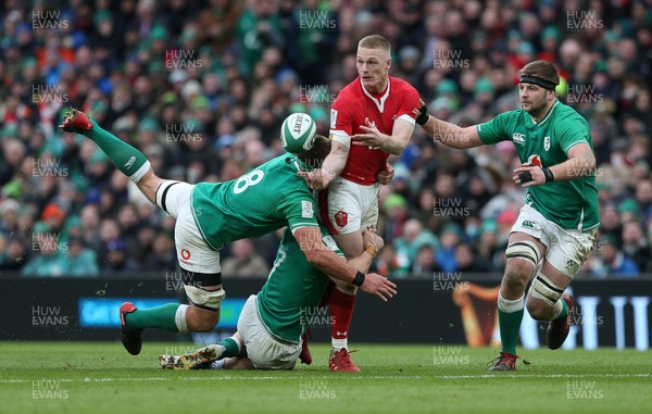 080220 - Ireland v Wales - Guinness 6 Nations - Johnny McNicholl of Wales is tackled by Josh van der Flier and CJ Stander of Ireland