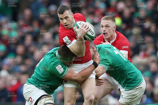 080220 - Ireland v Wales - Guinness 6 Nations - Gareth Davies of Wales is tackled by is tackled by CJ Stander and Jonathan Sexton of Ireland