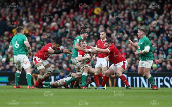 080220 - Ireland v Wales - Guinness 6 Nations - Nick Tompkins of Wales is tackled by Iain Henderson of Ireland