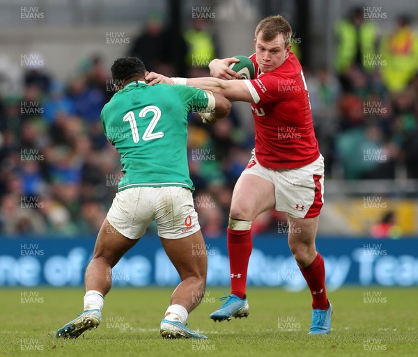 080220 - Ireland v Wales - Guinness 6 Nations - Nick Tompkins of Wales is tackled by Bundee Aki of Ireland