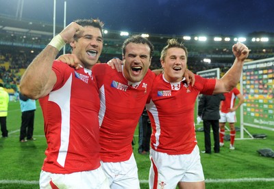 08.10.11 - Ireland v Wales - Rugby World Cup Quarter-Final 2011 - Mike Phillips, Jamie Roberts and Jonathan Davies of Wales celebrate at the end of the game. 