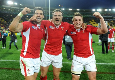 08.10.11 - Ireland v Wales - Rugby World Cup Quarter-Final 2011 - Mike Phillips, Jamie Roberts and Jonathan Davies of Wales celebrate at the end of the game. 