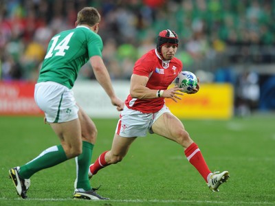 08.10.11 - Ireland v Wales - Rugby World Cup Quarter-Final 2011 - Leigh Halfpenny of Wales takes on Tommy Bowe of Ireland. 