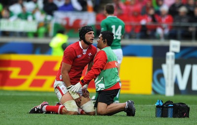 08.10.11 - Ireland v Wales - Rugby World Cup Quarter-Final 2011 - Luke Charteris of Wales is treated by physio Prav Mathema. 