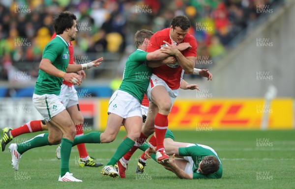 08.10.11 - Ireland v Wales - Rugby World Cup Quarter-Final 2011 - Jamie Roberts of Wales is tackled by Ronan O'Gara of Ireland. 