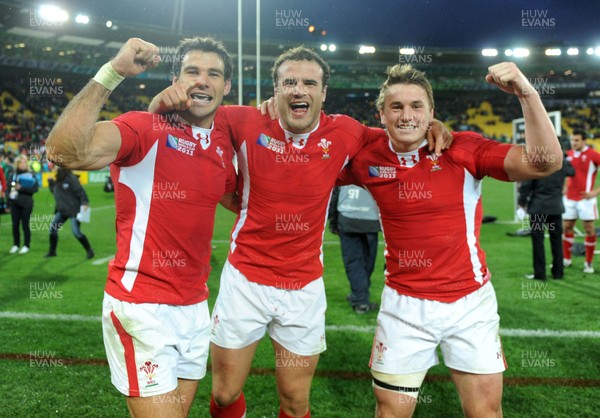 08.10.11 - Ireland v Wales - Rugby World Cup Quarter-Final 2011 - Mike Phillips, Jamie Roberts and Jonathan Davies of Wales celebrate at the end of the game. 