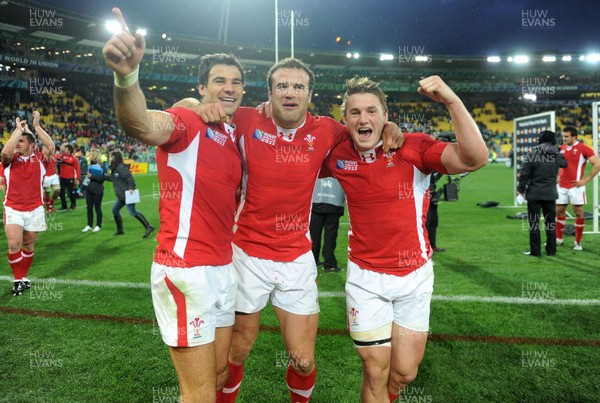 08.10.11 - Ireland v Wales - Rugby World Cup Quarter-Final 2011 - Mike Phillips, Jamie Roberts and Jonathan Davies of Wales celebrate at the end of the game. 