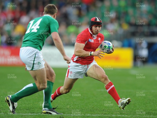 08.10.11 - Ireland v Wales - Rugby World Cup Quarter-Final 2011 - Leigh Halfpenny of Wales takes on Tommy Bowe of Ireland. 