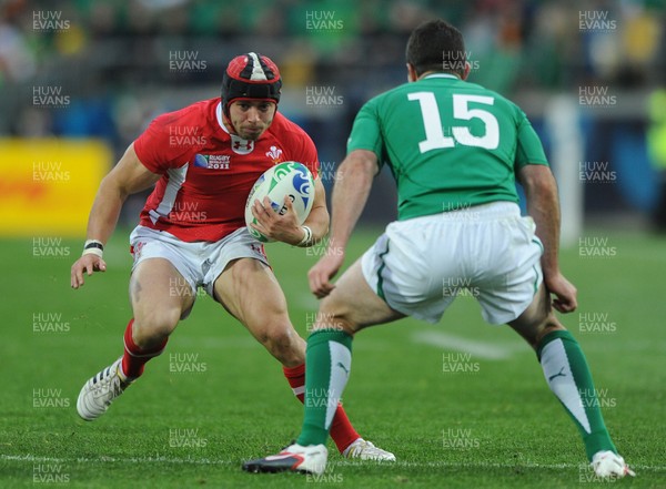 08.10.11 - Ireland v Wales - Rugby World Cup Quarter-Final 2011 - Leigh Halfpenny of Wales takes on Rob Kearney of Ireland. 