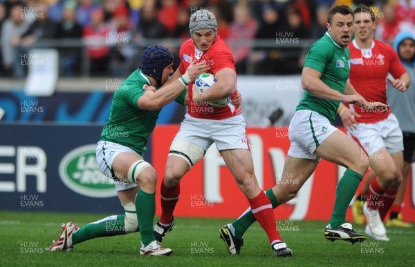 08.10.11 - Ireland v Wales - Rugby World Cup Quarter-Final 2011 - Jonathan Davies of Wales is tackled by Sean O'Brien of Ireland. 