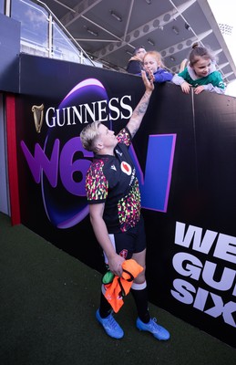 090526 - Ireland v Wales, 2026 Guinness Women’s 6 Nations - Donna Rose of Wales high fives a young fan ahead of the match