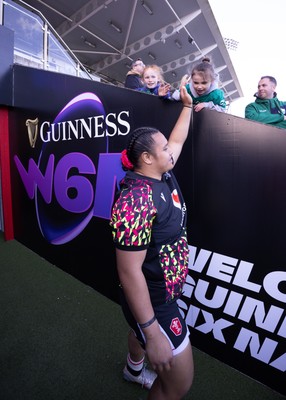 090526 - Ireland v Wales, 2026 Guinness Women’s 6 Nations - Sisilia Tuipulotu of Wales high fives a young fan ahead of the match