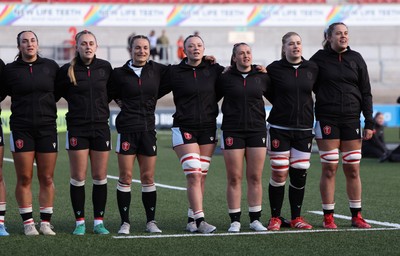090526 - Ireland v Wales, 2026 Guinness Women’s 6 Nations - Left to right, Courtney Keight of Wales, Hannah Dallavalle of Wales, Jasmine Joyce of Wales, Alisha Joyce of Wales, Kayleigh Powell of Wales, Bethan Lewis of Wales and Natalia John of Wales line up for the anthems ahead of the match