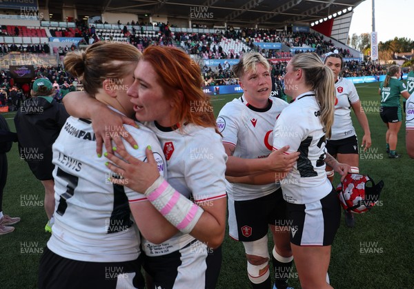 090526 - Ireland v Wales, 2026 Guinness Women’s 6 Nations - Bethan Lewis of Wales, Georgia Evans of Wales, Donna Rose of Wales and Freya Bell of Wales embrace at the end of the match 