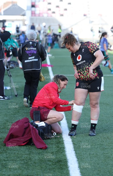 090526 - Ireland v Wales, 2026 Guinness Women’s 6 Nations - Georgina Ewer adjusts strapping for Gwenllian Pyrs of Wales