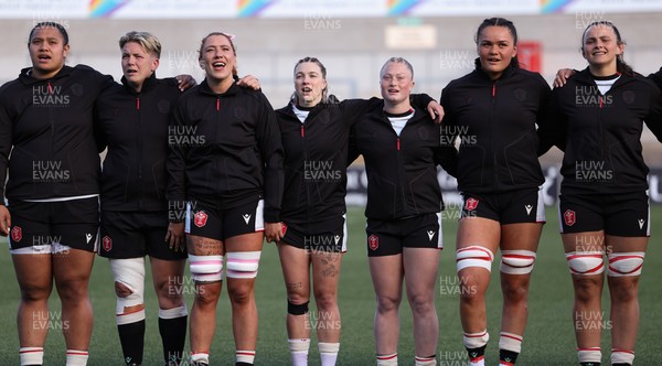 090526 - Ireland v Wales, 2026 Guinness Women’s 6 Nations - Left to right, Sisilia Tuipulotu of Wales, Donna Rose of Wales, Georgia Evans of Wales, Keira Bevan of Wales, Seren Lockwood of Wales, Jorja Aiono of Wales and Branwen Metcalfe of Wales line up for the anthems ahead of the match