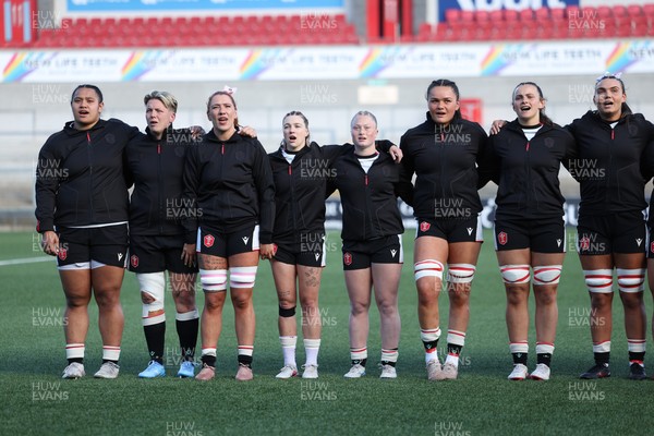 090526 - Ireland v Wales, 2026 Guinness Women’s 6 Nations - Left to right, Sisilia Tuipulotu of Wales, Donna Rose of Wales, Georgia Evans of Wales, Keira Bevan of Wales, Seren Lockwood of Wales, Jorja Aiono of Wales, Branwen Metcalfe of Wales and Bryonie King of Wales line up for the anthems ahead of the match